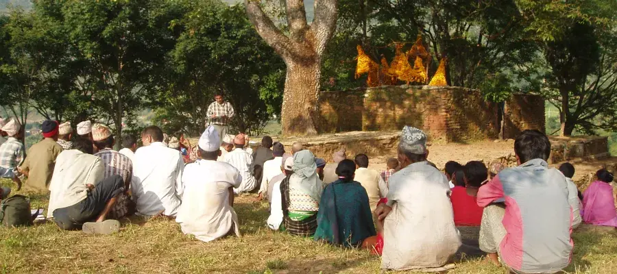 people sitting on ground and talking
