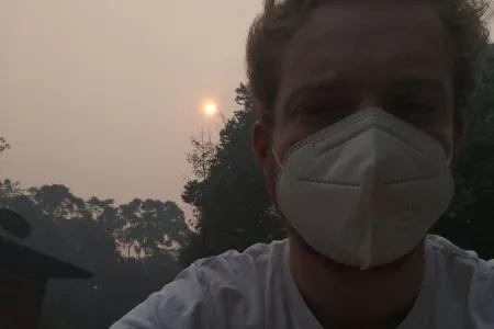 person among deforestation smoke